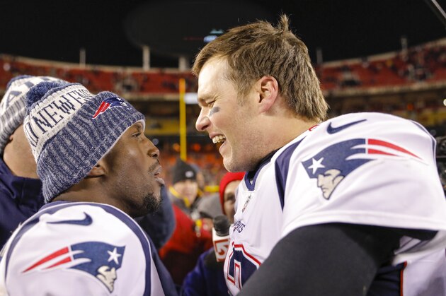 KANSAS CITY, MO - JANUARY 20: Quarterback Tom Brady #12 of the New England Patriots celebrates with teammate free safety Devin McCourty #32 of the New England Patriots following the Patriots' 37-31 overtime win in the AFC Championship Game against the Kansas City Chiefs at Arrowhead Stadium on January 20, 2019 in Kansas City, Missouri. (Photo by David Eulitt/Getty Images)
