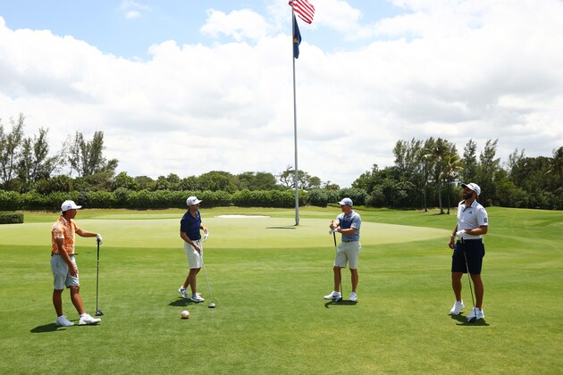 JUNO BEACH, FLORIDA - MAY 17: (L-R) Rickie Fowler of the CDC Foundation team, Matthew Wolff of the CDC Foundation team, Rory McIlroy of the American Nurses Foundation team and Dustin Johnson of the American Nurses Foundation team warm up prior to the TaylorMade Driving Relieve Supported By UnitedHealth Group on May 17, 2020 at Seminole Golf Club in Juno Beach, Florida. (Photo by Mike Ehrmann/Getty Images)