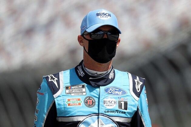 DARLINGTON, SOUTH CAROLINA - MAY 17: Kevin Harvick, driver of the #4 Busch Light YOURFACEHERE Ford, walks pit road prior to the start of the NASCAR Cup Series The Real Heroes 400 at Darlington Raceway on May 17, 2020 in Darlington, South Carolina. NASCAR resumes the season after the nationwide lockdown due to the ongoing coronavirus (COVID-19).  (Photo by Chris Graythen/Getty Images)