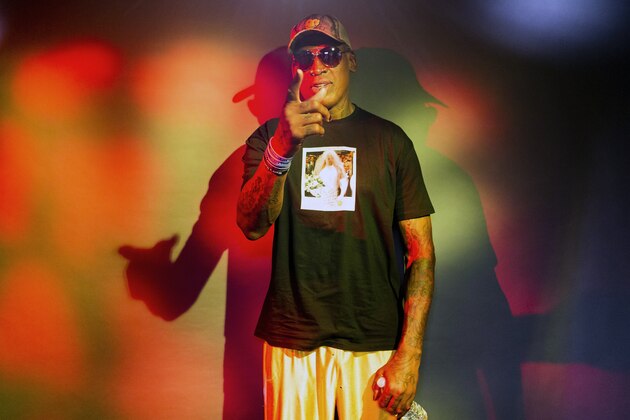 In this Monday, Sept. 9, 2019, photo, former NBA star Dennis Rodman poses wearing a T-shirt depicting himself in a wedding dress at a 1996 book promo event, in Los Angeles. Rodman's spectacular personal highs and very public lows are the subject of the new ESPN