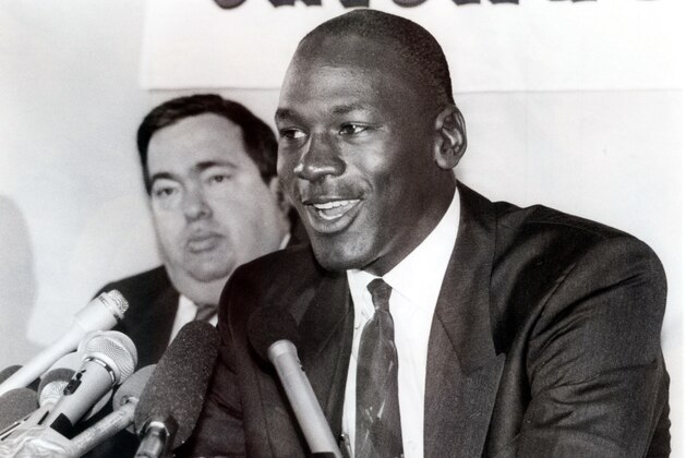 Jerry Krause, left, general manager of the Chicago Bulls, is shown with Bulls legend Michael Jordan in this Sept. 20, 1988 photo after Jordan agreed to an eight-year contract extension. Krause, who built a team around Jordan that won six national titles, resigned Monday, April 7, 2003, citing health problems. (AP Photo/Mark Elias)