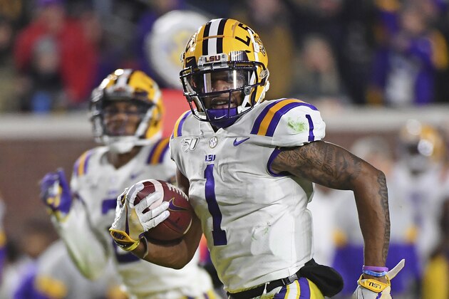 LSU wide receiver Ja'Marr Chase (1) carries the ball during the second half of an NCAA college football game against Mississippi in Oxford, Miss., Saturday, Nov. 16, 2019. No. 1 LSU won 58-37. (AP Photo/Thomas Graning)