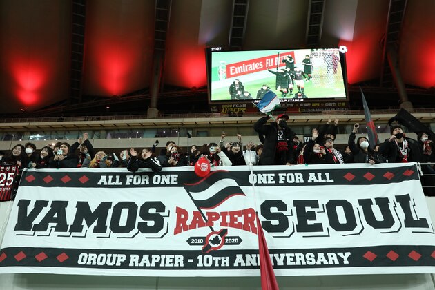 SEOUL, SOUTH KOREA - FEBRUARY 18: FC Seoul fans cheer after the AFC Champions League Group E match between FC Seoul and Melbourne Victory at the Seoul World Cup Stadium on February 18, 2020 in Seoul, South Korea. (Photo by Chung Sung-Jun/Getty Images)