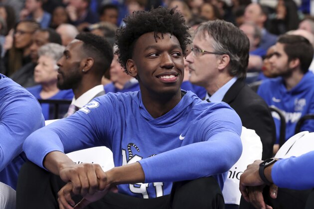 Memphis' James Wiseman watches the game from the bench in the second half of an NCAA college basketball game against Ole Miss Saturday, Nov. 23, 2019, in Memphis, Tenn. (AP Photo/Karen Pulfer Focht) Memphis' James Wiseman watches the game from the bench in the second half of an NCAA college basketball game against Ole Miss Saturday, Nov. 23, 2019, in Memphis, Tenn. (AP Photo/Karen Pulfer Focht)