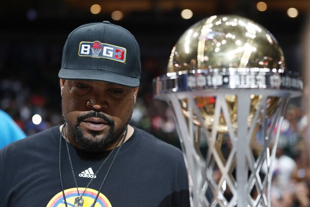 DALLAS, TEXAS - AUGUST 17: BIG3 founder Ice Cube stands with the BIG3 2018 Championship trophy during week nine of the BIG3 three on three basketball league at American Airlines Center on August 17, 2019 in Dallas, Texas. (Photo by Ronald Martinez/BIG3 via Getty Images) DALLAS, TEXAS - AUGUST 17: BIG3 founder Ice Cube stands with the BIG3 2018 Championship trophy during week nine of the BIG3 three on three basketball league at American Airlines Center on August 17, 2019 in Dallas, Texas. (Photo by Ronald Martinez/BIG3 via Getty Images)