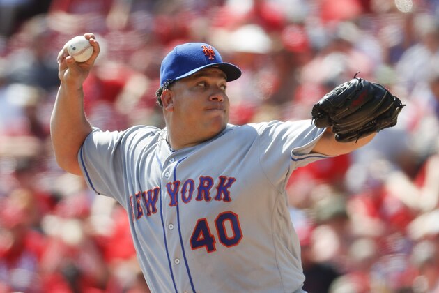 FILE - In this Sept. 5, 2016, file photo, New York Mets starting pitcher Bartolo Colon throws in the second inning of a baseball game against the Cincinnati Reds in Cincinnati. A pair of 40-something right-handers, Colon and R.A. Dickey, were signed as placeholders for the Atlanta Braves' wave of young starting pitchers that are left to compete for one or two spots in the rotation when spring training begins next week.  (AP Photo/John Minchillo, File)