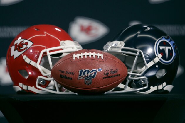 Helmets for the Kansas City Chiefs and the Tennessee Titans are displayed during a news conference for this weeks NFL conference championship football game at Arrowhead Stadium in Kansas City, Mo., Thursday, Jan. 16, 2020. (AP Photo/Charlie Riedel)