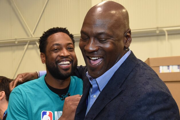 CHARLOTTE, NC - FEBRUARY 15:  Dwyane Wade #3 of the Miami Heat and Michael Jordan participate during the 2019 NBA Cares All-Star Day of Service at Second Harvest Food bank of Metrolina on February 15, 2019 in Charlotte, North Carolina. NOTE TO USER: User expressly acknowledges and agrees that, by downloading and or using this photograph, User is consenting to the terms and conditions of the Getty Images License Agreement. Mandatory Copyright Notice: Copyright 2019 NBAE (Photo by Andrew D. Bernstein/NBAE via Getty Images)