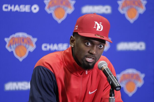 New York Knicks' Bobby Portis meets with reporters outside of the locker room after the team's NBA basketball game against the Washington Wizards, Tuesday, March 10, 2020, in Washington. The Wizards won 122-115. (AP Photo/Luis M. Alvarez)