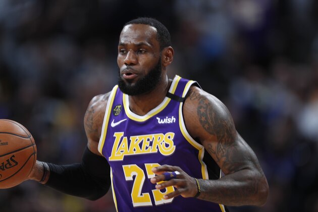 Los Angeles Lakers forward LeBron James brings the ball up during the first half of the team's NBA basketball game against the Denver Nuggets on Wednesday, Feb. 12, 2020, in Denver. (AP Photo/David Zalubowski) Los Angeles Lakers forward LeBron James brings the ball up during the first half of the team's NBA basketball game against the Denver Nuggets on Wednesday, Feb. 12, 2020, in Denver. (AP Photo/David Zalubowski)