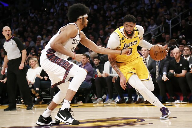 LOS ANGELES, CA - MARCH 10: Anthony Davis #3 of the Los Angeles Lakers handles the ball against Jarrett Allen #31 of the Brooklyn Nets during a game at the Staples Center on March 10, 2020 in Los Angeles, CA. NOTE TO USER: User expressly acknowledges and agrees that, by downloading and or using this photograph, User is consenting to the terms and conditions of the Getty Images License Agreement. Mandatory Credit: 2020 NBAE (Photo by Chris Elise/NBAE via Getty Images)