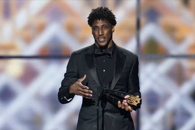 New Orleans Saints' Michael Thomas with his AP Offensive Player of the Year award at the NFL Honors football award show Saturday, Feb. 1, 2020, in Miami. (AP Photo/David J. Phillip)