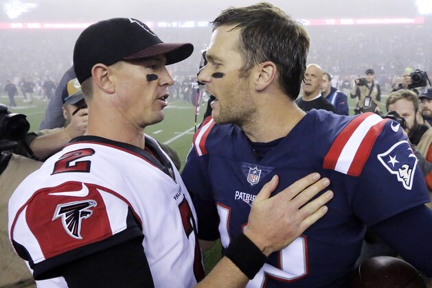 Atlanta Falcons quarterback Matt Ryan, left, and New England Patriots quarterback Tom Brady, right, speak at midfield after an NFL football game, Sunday, Oct. 22, 2017, in Foxborough, Mass. (AP Photo/Steven Senne)