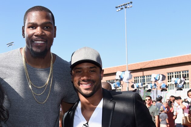 LOS ANGELES, CA - JULY 17: (L-R) College basketball player Anna Wilson with NBA player Kevin Durant and NFL quarterback Russell Wilson attends Nickelodeon Kids' Choice Sports Awards 2014 at UCLA's Pauley Pavilion on July 17, 2014 in Los Angeles, California.  (Photo by Michael Buckner/Getty Images For Nickelodeon)