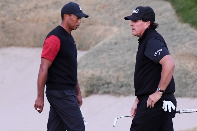 LAS VEGAS, NV - NOVEMBER 23:  Tiger Woods and Phil Mickelson walk on the 18th hole during The Match: Tiger vs Phil at Shadow Creek Golf Course on November 23, 2018 in Las Vegas, Nevada.  (Photo by Harry How/Getty Images for The Match)