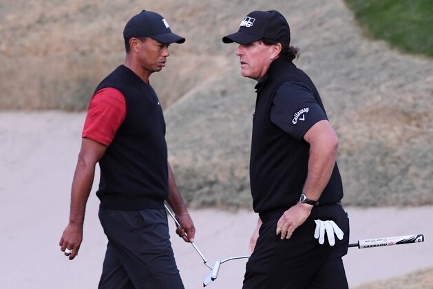LAS VEGAS, NV - NOVEMBER 23:  Tiger Woods and Phil Mickelson walk on the 18th hole during The Match: Tiger vs Phil at Shadow Creek Golf Course on November 23, 2018 in Las Vegas, Nevada.  (Photo by Harry How/Getty Images for The Match)