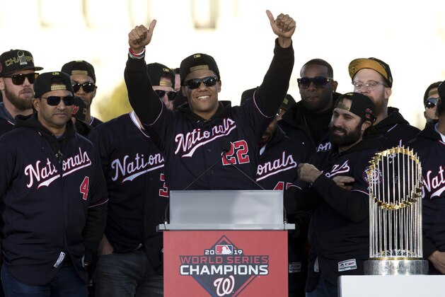 Washington Nationals left fielder Juan Soto, celebrates with the team during a rally following a parade to celebrate the team's World Series baseball championship over Houston Astros, Saturday, Nov. 2, 2019, in Washington. (AP Photo/Jose Luis Magana)