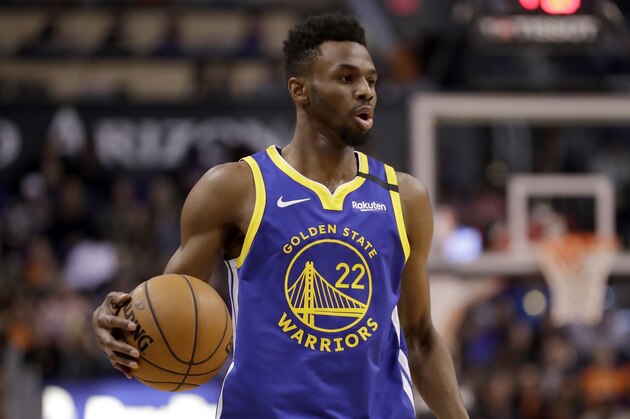 Golden State Warriors guard Andrew Wiggins (22) looks to pass against the Phoenix Suns during the second half of an NBA basketball game, Wednesday, Feb. 12, 2020, in Phoenix. (AP Photo/Matt York) Golden State Warriors guard Andrew Wiggins (22) looks to pass against the Phoenix Suns during the second half of an NBA basketball game, Wednesday, Feb. 12, 2020, in Phoenix. (AP Photo/Matt York)