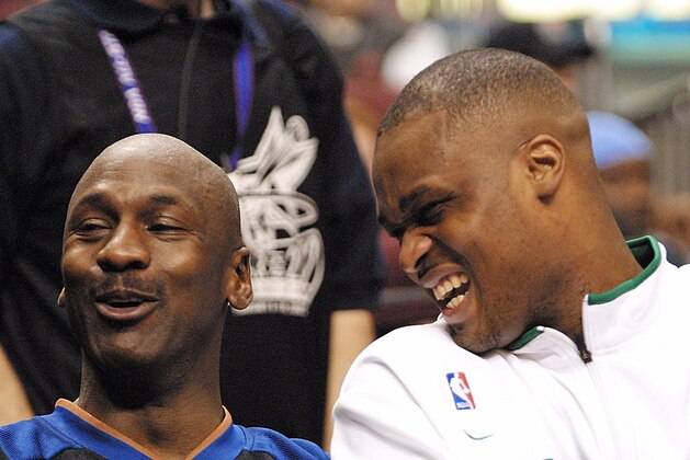 PHILADELPHIA, :  Michael Jordan, (L), of the Washington Wizards, and Antoine Walker, (R) of the Boston Celtic, laugh on the bench of the East All-Stars during the 2nd period of the NBA All-Star Game 10 February 2002 in the First Union Center, in Philadelphia, PA. AFP PHOTO/ TOM MIHALEK (Photo credit should read TOM MIHALEK/AFP via Getty Images)
