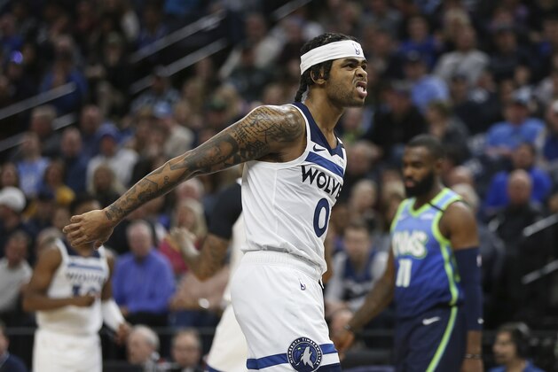 Minnesota Timberwolves' D'Angelo Russell reacts to the action in the second half of an NBA basketball game against the Dallas Mavericks, Sunday, March 1, 2020, in Minneapolis. Dallas won 111-91. (AP Photo/Stacy Bengs)