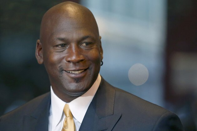 FILE - In this Aug. 21, 2015, file photo, former NBA star Michael Jordan smiles at reporters in Chicago. Nike is opening a Michael Jordan-only store in Chicago's Loop on Saturday, Oct. 24, 2015. The new Jordan Brand store will sell merchandise with the trademarked Michael Jordan FILE - In this Aug. 21, 2015, file photo, former NBA star Michael Jordan smiles at reporters in Chicago. Nike is opening a Michael Jordan-only store in Chicago's Loop on Saturday, Oct. 24, 2015. The new Jordan Brand store will sell merchandise with the trademarked Michael Jordan