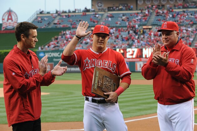 ANAHEIM, CA - APRIL 13:  Mike Trout #27 (C) of the Los Angeles Angels of Anaheim is presented with the Jackie Robinson Rookie of the Year Award before the game against the Houston Astros at Angel Stadium of Anaheim on April 13, 2013 in Anaheim, California.  (Photo by Lisa Blumenfeld/Getty Images)