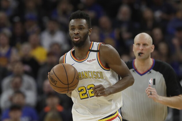 Golden State Warriors guard Andrew Wiggins (22) against the Toronto Raptors during an NBA basketball game in San Francisco, Thursday, March 5, 2020. (AP Photo/Jeff Chiu)