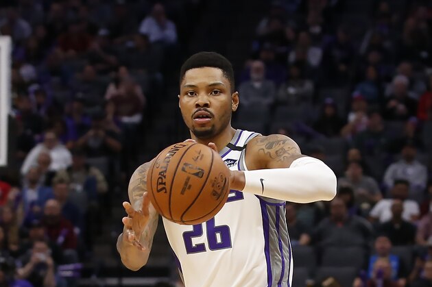 Sacramento Kings guard Kent Bazemore passes the ball during the second half of an NBA basketball game against the Washington Wizards in Sacramento, Calif., Tuesday, March 3, 2020. The Kings won 133-126. (AP Photo/Rich Pedroncelli)