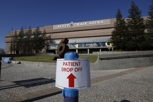 A temporary sign is placed at the the Sleep Train Arena that is being turned into a 400-bed emergency field hospital to help deal with the coronavirus, in Sacramento, Calif., Saturday, April 18, 2020. The arena, the former home of the NBA's Sacramento Kings basketball team, is expected to begin receiving patients Monday. (AP Photo/Rich Pedroncelli,)