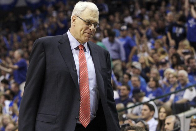 Los Angeles Lakers coach Phil Jackson heads back to the bench during the second half of Game 4 of a second-round NBA playoff basketball series against the Dallas Mavericks, Sunday, May 8, 2011, in Dallas. The Mavericks won 122-86, sweeping the series. (AP Photo/Tony Gutierrez) Los Angeles Lakers coach Phil Jackson heads back to the bench during the second half of Game 4 of a second-round NBA playoff basketball series against the Dallas Mavericks, Sunday, May 8, 2011, in Dallas. The Mavericks won 122-86, sweeping the series. (AP Photo/Tony Gutierrez)