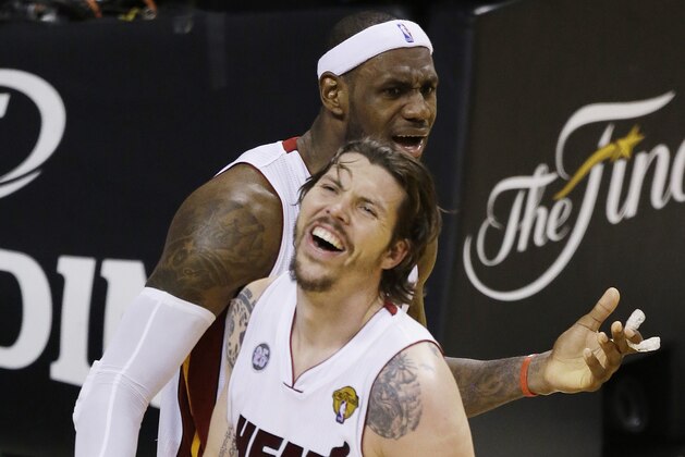 Miami Heat shooting guard Mike Miller (13) and Miami Heat small forward LeBron James (6) laugh at an official's call during the second half of Game 6 of the NBA Finals basketball game against the San Antonio Spurs, Tuesday, June 18, 2013 in Miami. (AP Photo/Wilfredo Lee)