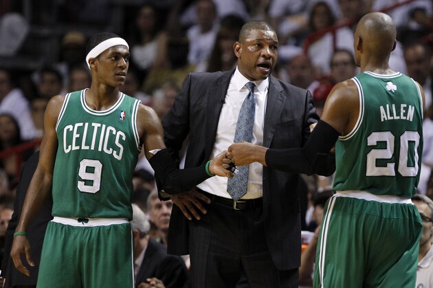 Boston Celtics' Doc Rivers, center,  talks to Boston Celtics' Ray Allen (20) and Rajon Rondo (9) during the second half of Game 5 in their NBA basketball Eastern Conference finals playoffs series, Tuesday, June 5, 2012, in Miami. (AP Photo/Lynne Sladky)
