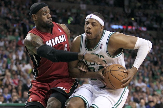 Miami Heat forward LeBron James, left, defends against Boston Celtics forward Paul Pierce, right, during the first quarter in Game 6 of the NBA basketball Eastern Conference finals, Thursday, June 7, 2012, in Boston. (AP Photo/Elise Amendola)