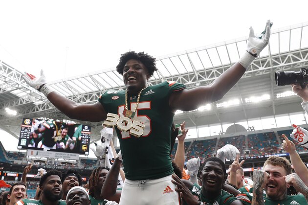 Miami defensive lineman Gregory Rousseau (15) celebrates a turnover and wears the turnover chain during the first half of an NCAA college football game against Central Michigan, Saturday, Sept. 21, 2019, in Miami Gardens, Fla. (AP Photo/Brynn Anderson) Miami defensive lineman Gregory Rousseau (15) celebrates a turnover and wears the turnover chain during the first half of an NCAA college football game against Central Michigan, Saturday, Sept. 21, 2019, in Miami Gardens, Fla. (AP Photo/Brynn Anderson)