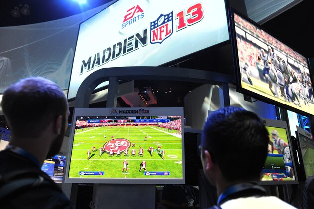 Gaming fans sample EA Sports Madden NFL 13 game on the second day of the E3 videogame extravaganza in Los Angeles on June 6, 2012 in California, where sequels to blockbuster console titles and play on smartphones or tablets are being showcased with Times Square-like glitz at the annual event. AFP PHOTO/Frederic J. BROWN        (Photo credit should read FREDERIC J. BROWN/AFP/GettyImages)