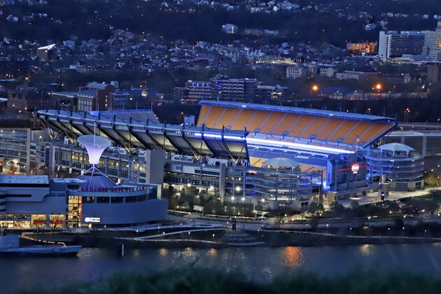 Heinz Field, the home of the Pittsburgh Steelers is lit up in blue to honor essential workers on the front line of the battle against COVID-19, in Pittsburgh, Thursday, April 9, 2020. (AP Photo/Gene J. Puskar)