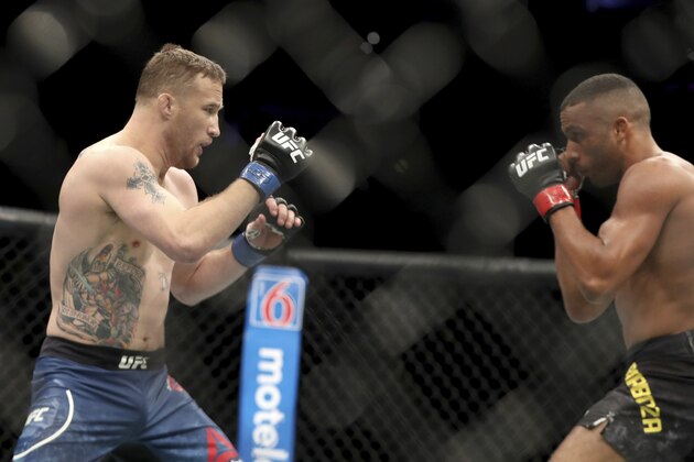 Justin Gaethje, left, in action against Edson Barboza during their mixed martial arts bout at UFC Fight Night, Saturday, March 30, 2019, in Philadelphia. Gaethje won via first round TKO. (AP Photo/Gregory Payan)