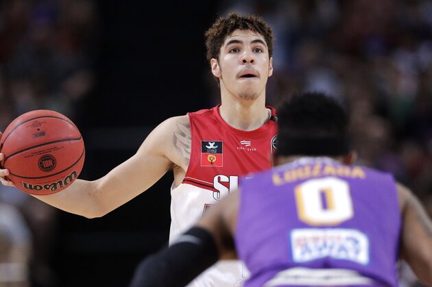 LaMelo Ball of the Illawarra Hawks carries the ball up during their game against the Sydney Kings in the Australian Basketball League in Sydney, Sunday, Nov. 17, 2019. (AP Photo/Rick Rycroft)