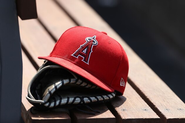 LOS ANGELES, CA - JULY 15:  A detailed view of an Los Angeles Angels of Anaheim hat and a catching glove is seen during the sixth inning of the MLB game between the Los Angeles Angels of Anaheim and the Los Angeles Dodgers at Dodger Stadium on July 15, 2018 in Los Angeles, California. The Dodgers defeated the Angels 5-3.  (Photo by Victor Decolongon/Getty Images)