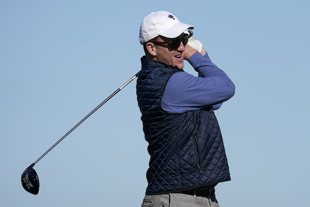 Peyton Manning follows his drive from the 16th tee of the Monterey Peninsula County Club Shore Course during the second round of the AT&T Pebble Beach National Pro-Am golf tournament Friday, Feb. 7, 2020, in Pebble Beach, Calif. (AP Photo/Tony Avelar)