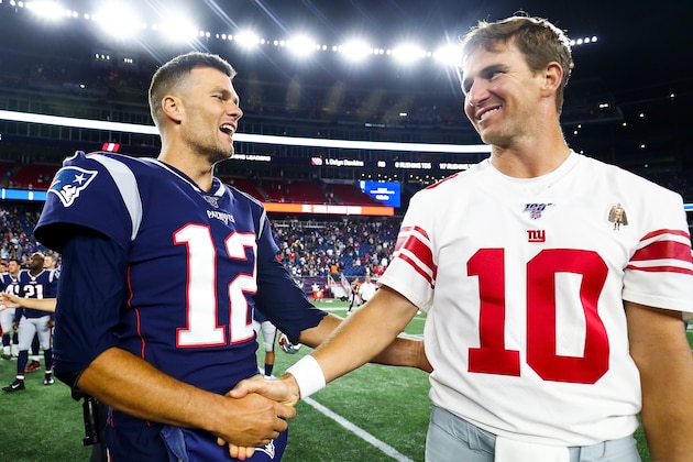 FOXBOROUGH, MA - AUGUST 29:   Tom Brady #12 of the New England Patriots greets Eli Manning #10 of the New York Giants after a preseason game at Gillette Stadium on August 29, 2019 in Foxborough, Massachusetts.  (Photo by Adam Glanzman/Getty Images)