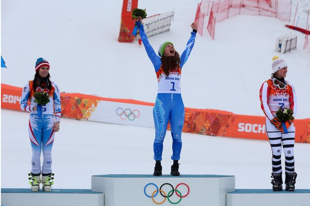 SOCHI, RUSSIA - FEBRUARY 18:  (L-R) Silver medalist Anna Fenninger of Austria, gold medalist Tina Maze of Slovenia and bronze medalist Viktoria Rebensburg of Germany celebrate on the podium during the flower ceremony for the Alpine Skiing Women's Giant Slalom on day 11 of the Sochi 2014 Winter Olympics at Rosa Khutor Alpine Center on February 18, 2014 in Sochi, Russia.  (Photo by Alexander Hassenstein/Getty Images)