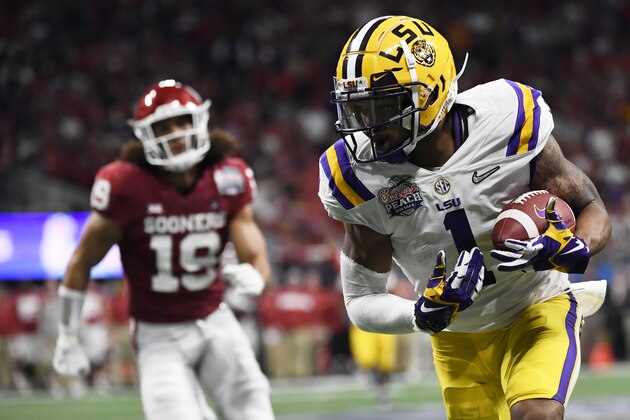 LSU wide receiver Ja'Marr Chase (1) runs against Oklahoma during the first half of the Peach Bowl NCAA semifinal college football playoff game, Saturday, Dec. 28, 2019, in Atlanta. (AP Photo/Danny Karnik)
