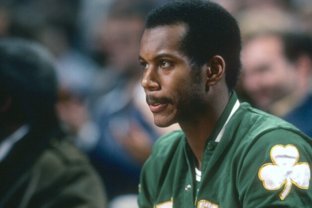 LANDOVER, MD - CIRCA 1978: Kermit Washington #26 of the Boston Celtics looks on from the bench against the Washington Bullets during an NBA basketball game circa 1978 at the Capital Centre in Landover, Maryland. Washington played for the Celtics from 1977-78. (Photo by Focus on Sport/Getty Images)
