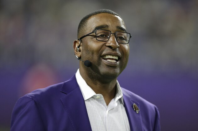 Former Minnesota Vikings wide receiver Cris Carter stands on the field before an NFL football game between the Vikings and the Green Bay Packers, Monday, Dec. 23, 2019, in Minneapolis. (AP Photo/Andy Clayton-King)
