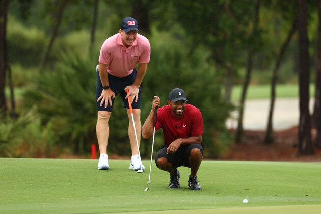 HOBE SOUND, FLORIDA - MAY 24: Tiger Woods and former NFL player Peyton Manning read a putt on the sixth green during The Match: Champions For Charity at Medalist Golf Club on May 24, 2020 in Hobe Sound, Florida. (Photo by Mike Ehrmann/Getty Images for The Match)
