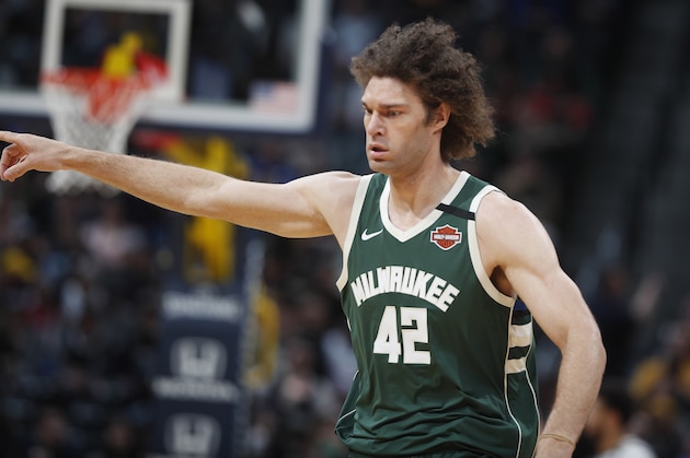 Milwaukee Bucks center Robin Lopez (42) in the first half of an NBA basketball game Monday, March 9, 2020, in Denver. (AP Photo/David Zalubowski)