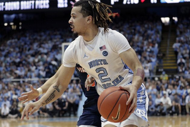North Carolina's Cole Anthony (2) drives against Virginia during the first half of an NCAA college basketball game at the Dean Smith Center in Chapel Hill, N.C., Saturday, Feb. 15, 2020. (AP Photo/Chris Seward)