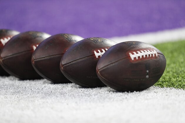 Footballs sit on the field before an NFL football game between the Minnesota Vikings and the Washington Redskins, Thursday, Oct. 24, 2019, in Minneapolis. (AP Photo/Charlie Neibergall)
