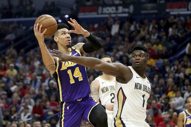 Los Angeles Lakers guard Danny Green (14) goes up for a basket as New Orleans Pelicans forward Zion Williamson (1) defends in the first half of an NBA basketball game in New Orleans, Sunday, March 1, 2020. (AP Photo/Rusty Costanza) Los Angeles Lakers guard Danny Green (14) goes up for a basket as New Orleans Pelicans forward Zion Williamson (1) defends in the first half of an NBA basketball game in New Orleans, Sunday, March 1, 2020. (AP Photo/Rusty Costanza)